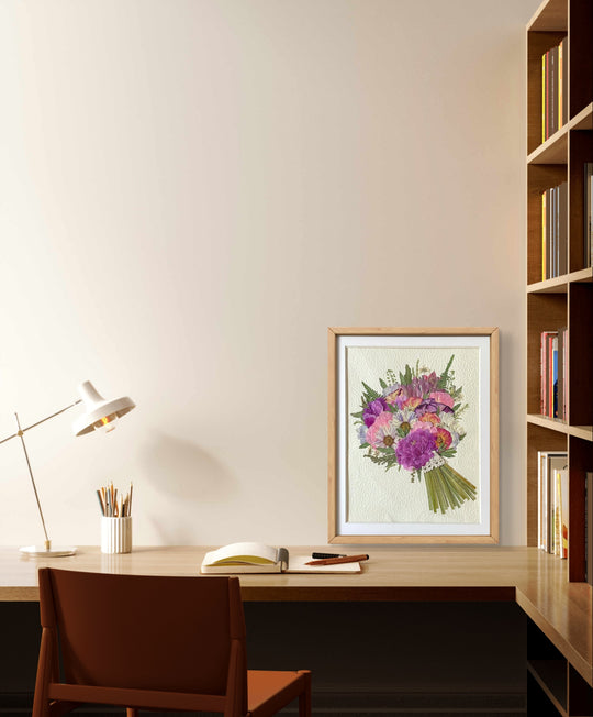 11 inches width 12.5 inches height pressed flower frame art that is purple style stands on the wood table.