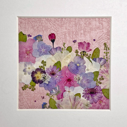 whole picture of 10 inches width 10 inches height pressed flower frame art that has pink theme