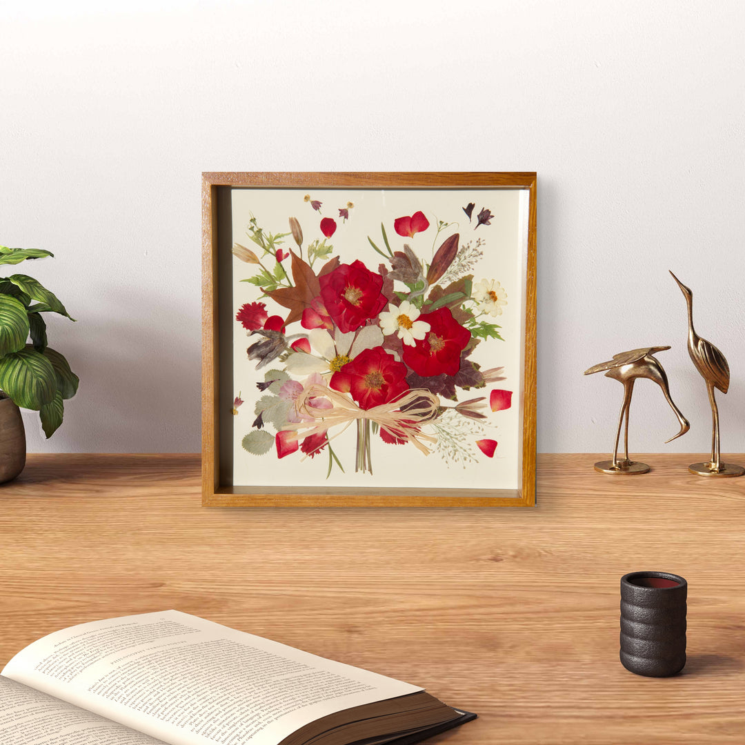 flower bouquet shaped red theme pressed flower frame art stands on wood desktop