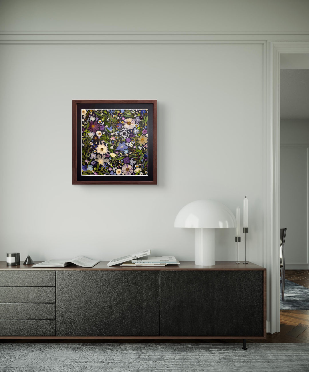 black background pressed flower frame art with flower petals hanging on the living room wall