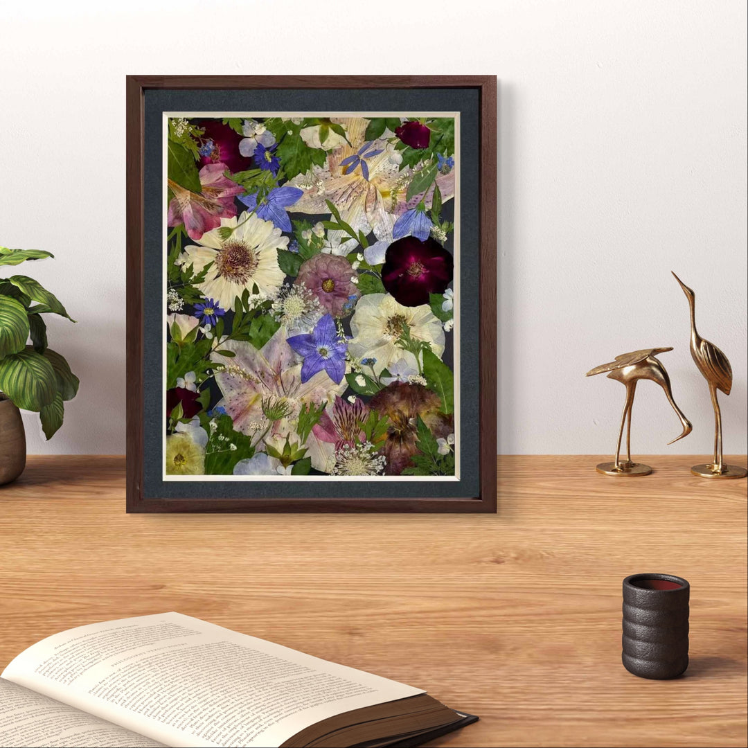 Sparkle stars theme 11 inches width 12.5 inches height pressed flower frame art stands on the wood table.