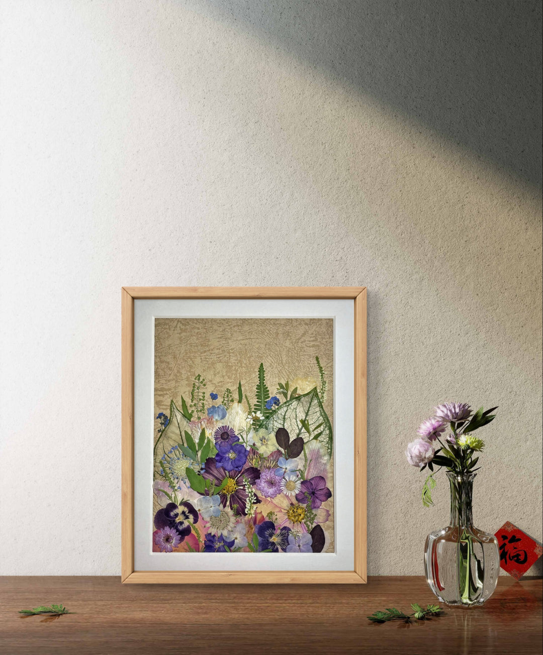 8.8 inches width 11 inches height pressed flower frame that presents vibrant spring stands on the wood table.