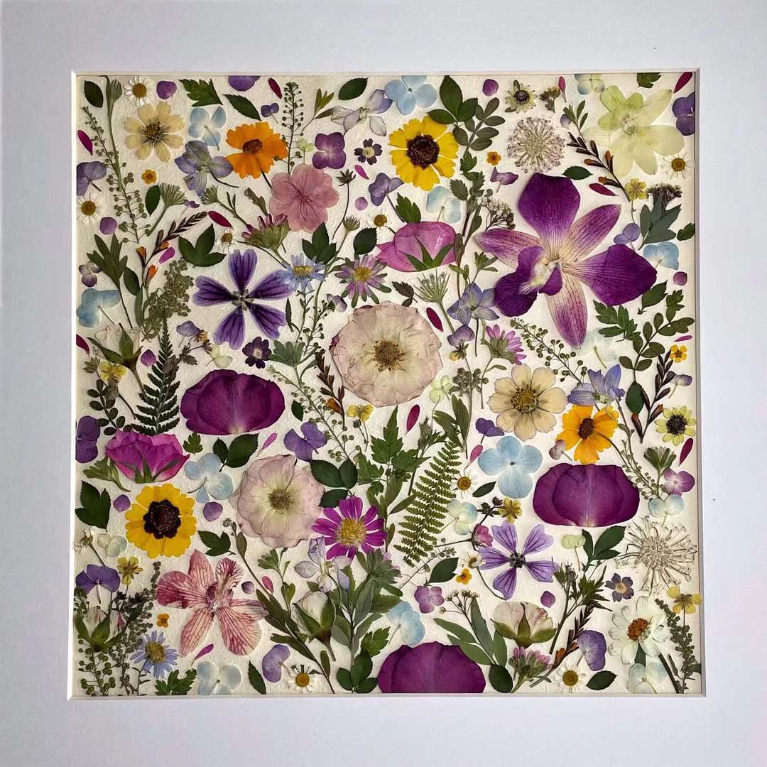 Full picture of 15.7 inch width 15.7 inch height pressed flower frame art that has vibrant and colorful petals formed design.