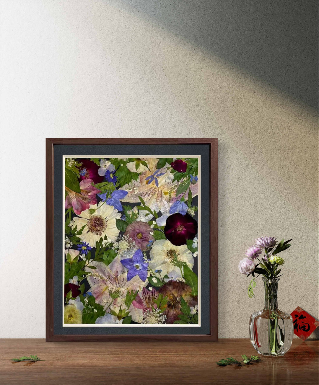 Sparkle stars theme 11 inches width 12.5 inches height pressed flower frame art stands on the wood table. 