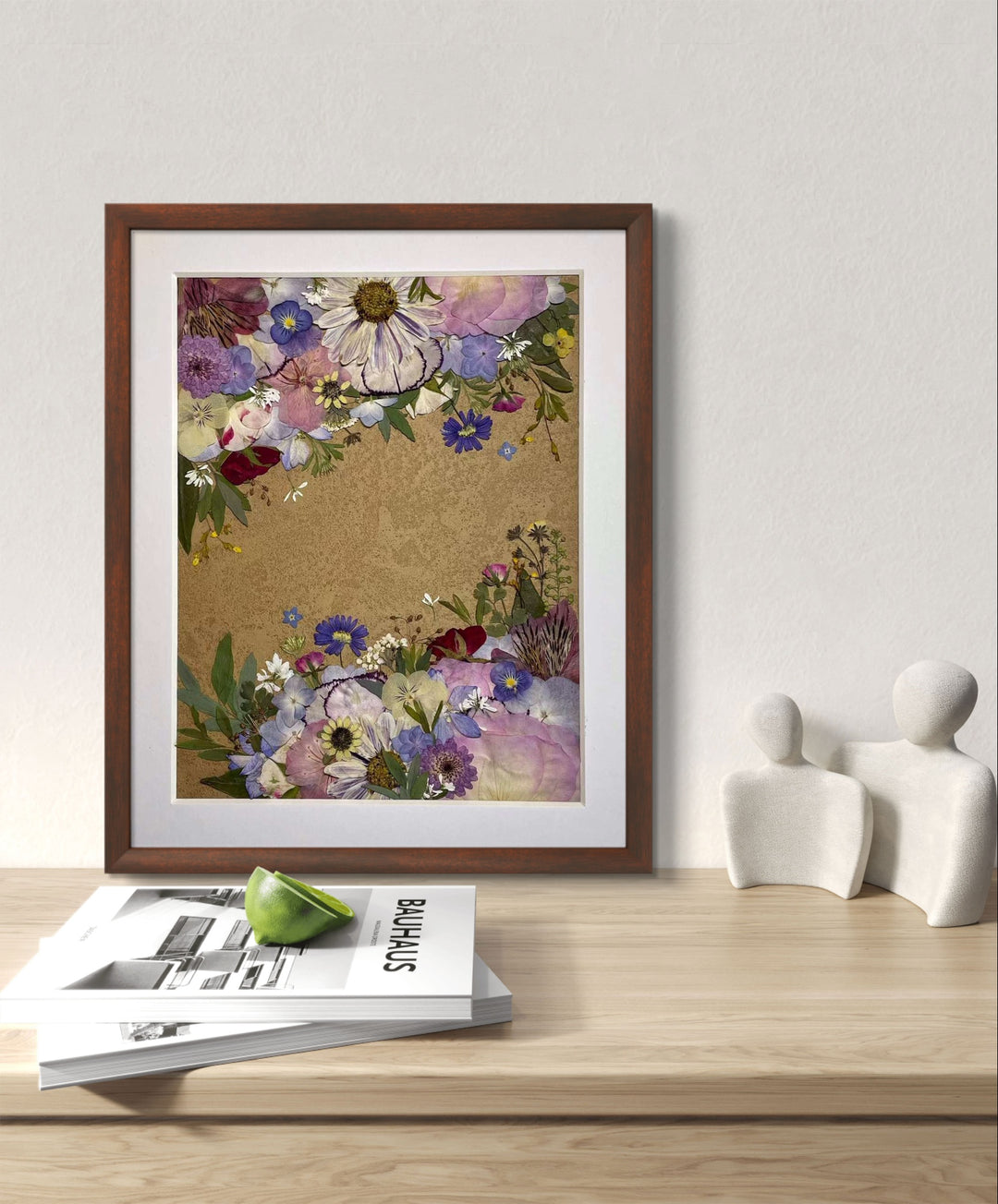 Garden symphony theme 11 inches width 12.5 inches height pressed flower frame art stands on the wood table.